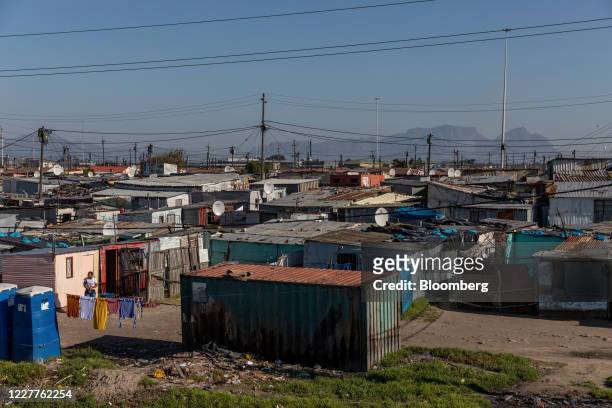 Informal housing stands at the Khayelitsha township as Table mountain stands beyond in Cape Town, South Africa, on Thursday, July 23, 2020. South...