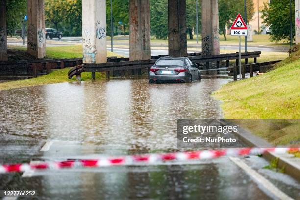 Car in high water during storm and flooding of the Seveso river on July 24, 2020 in Milan, Italy