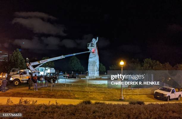 Statue of Christopher Columbus at Grant Park in Chicago is removed early on July 24, 2020. - Two statues of Christopher Columbus were taken down in...