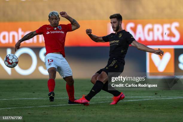 Carlos Junior of CD Santa Clara vies with Valeriy Bondarenko of Vitoria SC during the Liga Nos match between CD Santa Clara and Vitoria SC at Estadio...