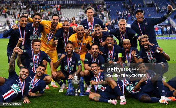 Paris Saint-Germain's players celebrate with the trophy after winning the French Cup final football match between Paris Saint-Germain and...