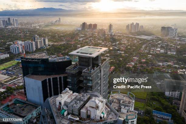 Early morning aerial view of Pasig City. Pasig City in and around the Ortigas Center area is popular for mall complexes, it has a large district, mix...