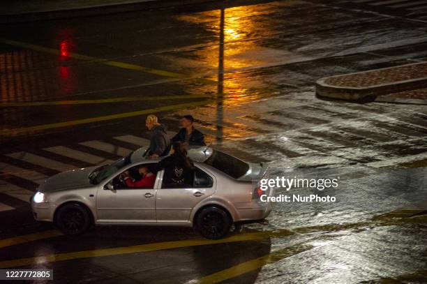 Street racers run from police soon after blocking a highway in Bogota's downtown during the lockdown caused by the novel Coronavirus pandemic in...