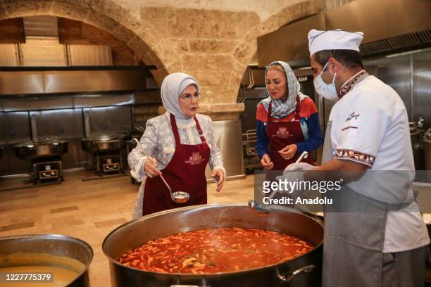 Turkish President Recep Tayyip Erdogan's wife Emine Erdogan distributes food to needy people at Istanbul's oldest soup kitchen Eyup Imaret's dining...