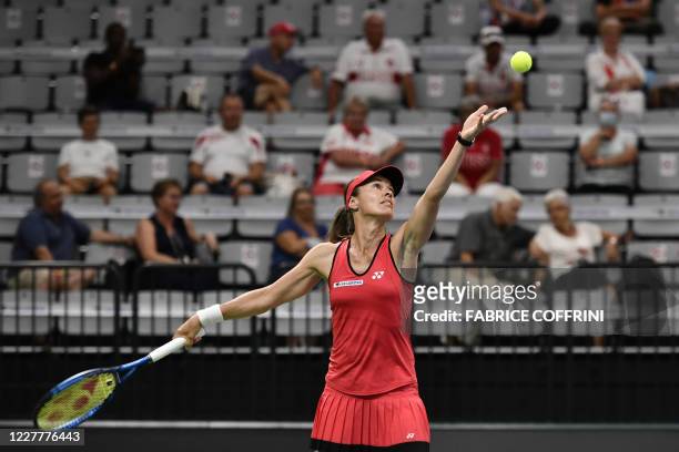 Swiss player Martina Hingis serves a ball during her match against compatriot Patty Schnyder at the Swiss Tennis Pro Cup exhibition tournament on...