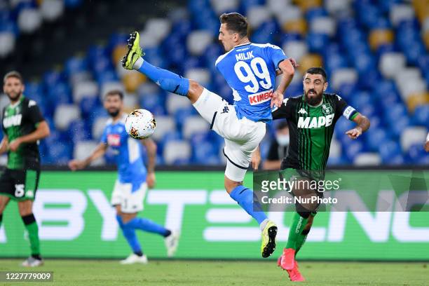Arkadiusz Milik of SSC Napoli jumps for the ball during the Serie A match between Napoli and Sassuolo at Stadio San Paolo, Naples, Italy on 25 July...