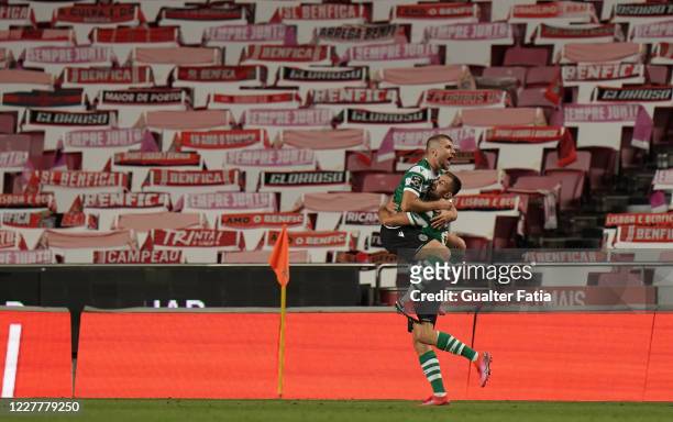 Andraz Sporar of Sporting CP celebrates with teammate Stefan Ristovski of Sporting CP after scoring a goal during the Liga NOS match between SL...