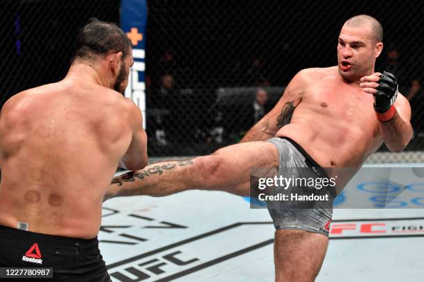In this handout image provided by UFC, Mauricio 'Shogun' Rua of Brazil kicks Antonio Rogerio Nogueira of Brazil in their light heavyweight fight...
