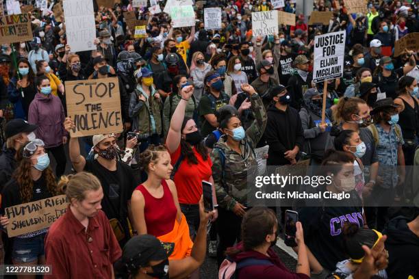 People march in the street to protest the death of Elijah McClain on July 25, 2020 in Aurora, Colorado. On August 24, 2019 McClain was walking home...