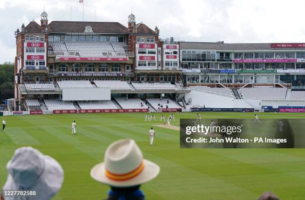 Spectators watch the action in front of a largely empty Mickey Stewart Pavilion during the friendly match at the Kia Oval, London during the friendly...