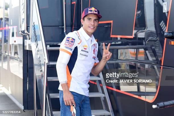 Repsol Honda Team's Spanish rider Marc Marquez makes the victory sign on the sidelines of the Andalucia Grand Prix at the Jerez race track in Jerez...