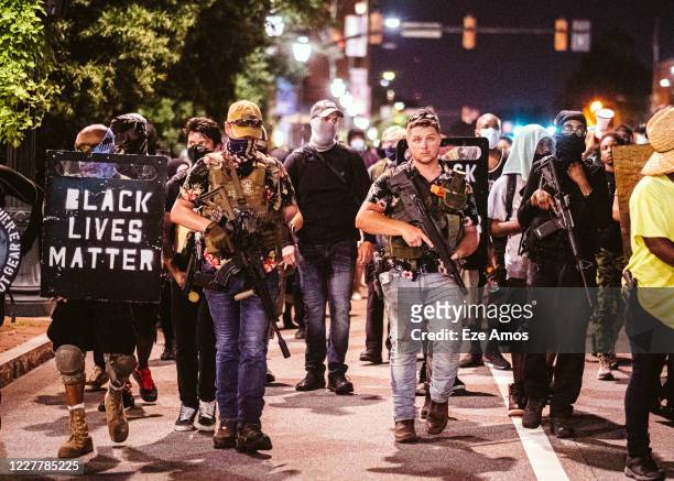The Boogaloo boys march with protesters on July 25, 2020 in Richmond, Virginia. Protesters in Richmond joined other protesters around the country for...