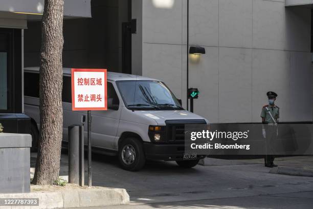 Vehicle with diplomatic plates drives out from the U.S. Consulate General Chengdu in Chengdu, China, on Sunday, July 26, 2020. The closure of the...