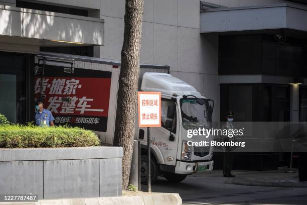Moving truck drives out from the U.S. Consulate General Chengdu in Chengdu, China, on Sunday, July 26, 2020. The closure of the U.S. Consulate in...