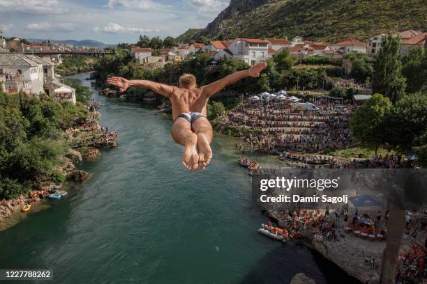 Competitor dives from Stari Most , the Ottoman era bridge destroyed in the country's 1992-95 war and later restored, during the 454th traditional...