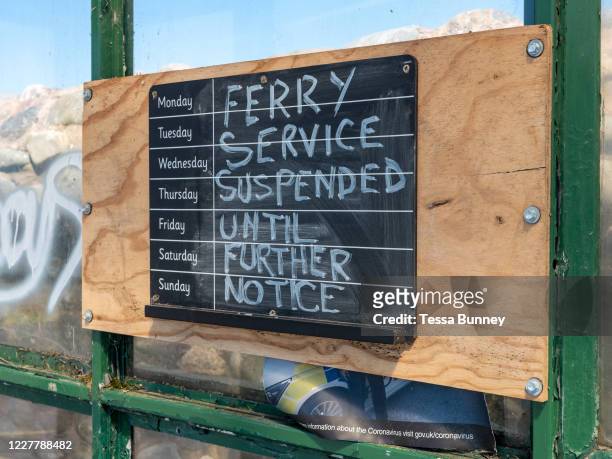 Ferry service suspended sign for the Knott End on Sea to Fleetwood service due to the Coronavirus pandemic on 14th May 2020 in Knott End on Sea,...