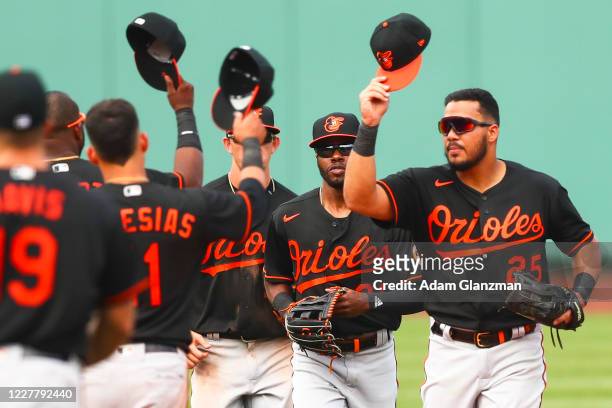 The Baltimore Orioles tap hats after defeating the Boston Red Sox at Fenway Park on July 26, 2020 in Boston, Massachusetts.