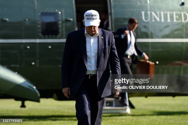 President Donald Trump walks off Marine One at the White House in Washington, DC, July 26, 2020 after spending the weekend at Bedminster, New Jersey.