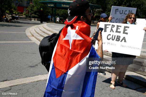 Demonstrators rally in Union Square against US economic and travel sanctions against Cuba, in New York City on July 26, 2020. Protesters against the...