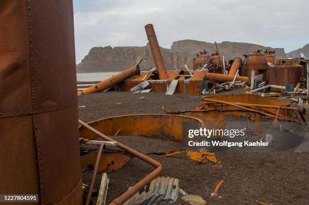 The rusty remains of an old whaling station at Whalers Bay, inside Port Foster, the caldera of Deception Island, an island in the South Shetland...
