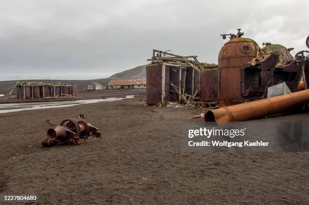 The rusty remains of an old whaling station at Whalers Bay, inside Port Foster, the caldera of Deception Island, an island in the South Shetland...