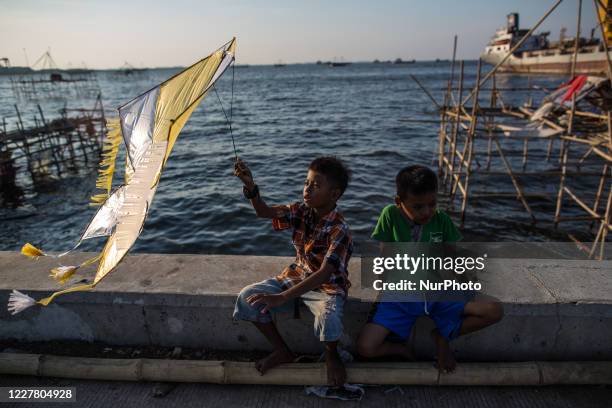 Kids prepares to fly a kite amid the spread of the coronavirus outbreak in Jakarta, Indonesia on July 27, 2020. According to The Indonesian...