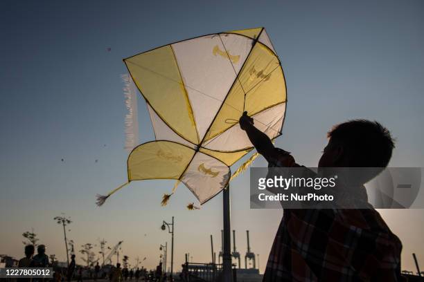 Kids prepares to fly a kite amid the spread of the coronavirus outbreak in Jakarta, Indonesia on July 27, 2020. According to The Indonesian...