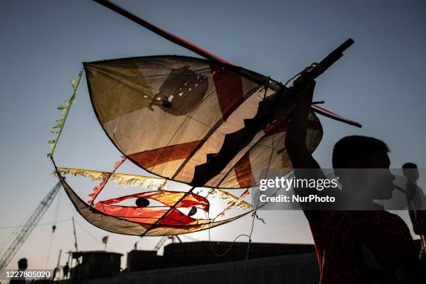 Kids prepares to fly a kite amid the spread of the coronavirus outbreak in Jakarta, Indonesia on July 27, 2020. According to The Indonesian...