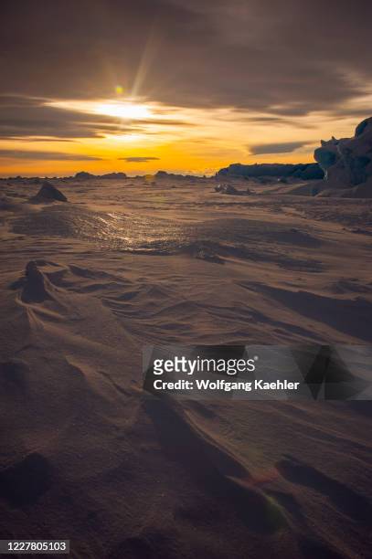 Dramatic sunset over the ice near Snow Hill Island in the Weddell Sea in Antarctica.