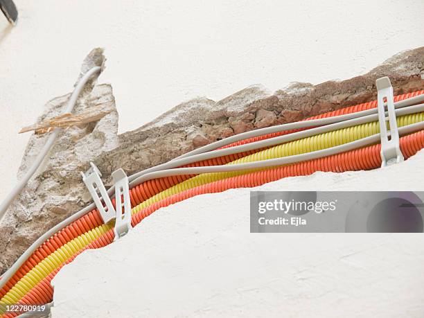 construction of electrical instalations - cable installation stock pictures, royalty-free photos & images