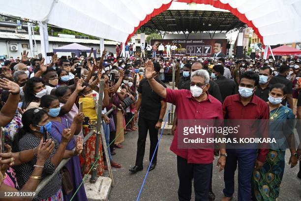 Sri Lanka's President Gotabaya Rajapaksa waves to supporters during a rally ahead of the upcoming parliamentary elections, near the capital Colombo...