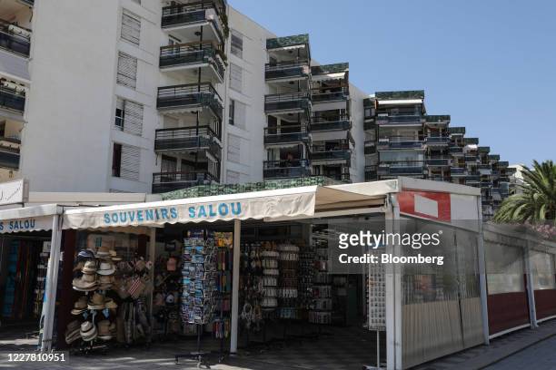 Holiday apartments stand above a souvenir shop in Salou, Spain, on Monday, July 27, 2020. Spain's tourism industry is at increasing risk of being...