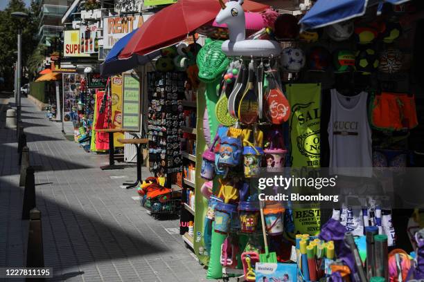 Souvenir shops line a street in Salou, Spain, on Monday, July 27, 2020. Spain's tourism industry is at increasing risk of being shut down as...