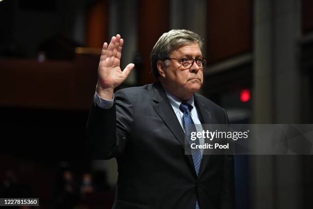 Attorney General William Barr takes the oath before he appears before the House Oversight Committee on July 28, 2020 on Capitol Hill in Washington...