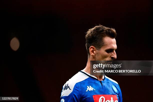 Napoli's Polish forward Arkadiusz Milik reacts during the Italian Serie A football match Inter Milan vs Napoli played behind closed doors at the San...