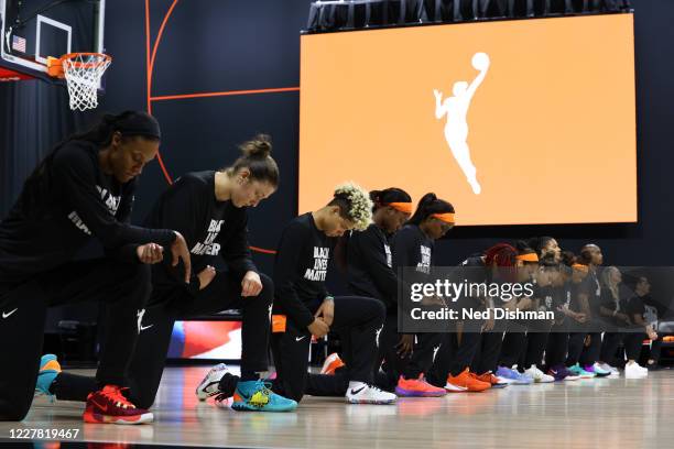 The Connecticut Sun kneel for the National Anthem prior to a game against the Washington Mystics on July 28, 2020 at Feld Entertainment Center in...