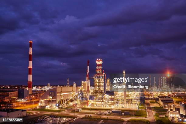 Lights illuminate pipework and refining towers at the Grupa Lotos SA oil refinery in Gdansk, Poland, on Tuesday, July 28, 2020. Polish refiner PKN...