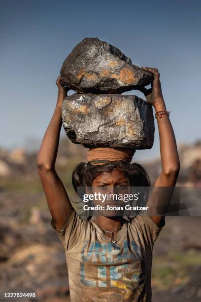 Taymana Kumari has piled coal on her head while she is working in Jharia coal field where a large portion of indias coal is mined. According to the...