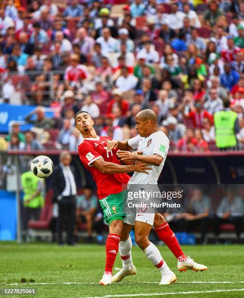 Joao Mario of Portugal and Nabil Dirar of Morocco in an in fight during the FIFA World Cup match Portugal versus Morocco at Luzhniki Stadium, Moscow,...