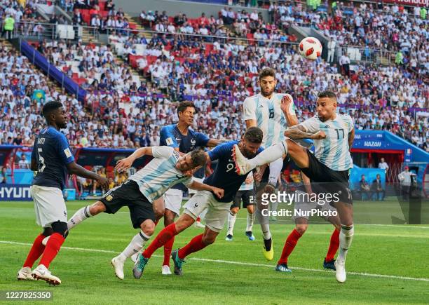 Federico Fazio of Argentina, Nicolas Otamendi of Argentina and Olivier Giroud of France trying to head to the ball during the FIFA World Cup match...