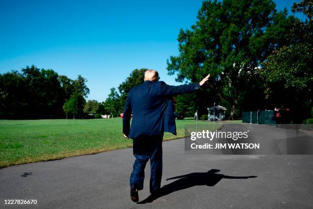 President Donald Trump waves after speaking during his departure from the White House in Washington, DC, on July 29, 2020 en route to Texas.