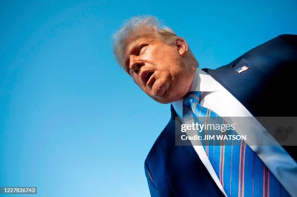 President Donald Trump speaks to the press as he departs the White House in Washington, DC, on July 29, 2020 en route to Texas.