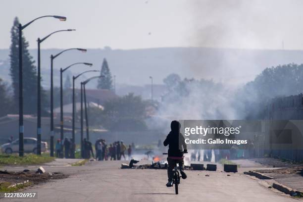 Bellville residents demonstrate during a large scale protest action in the Cape organised by the group Gatvol Capetonian on July 27, 2020 in Cape...