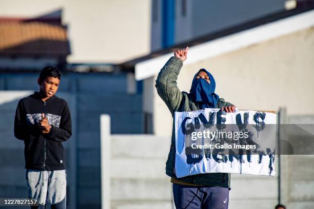 Residents demonstrate along the Duinefontein Road during a large scale protest action in the Cape organised by the group Gatvol Capetonian on July...