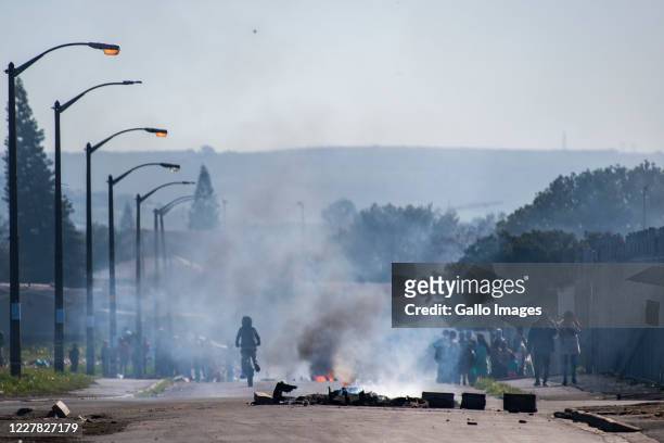 Bellville residents demonstrate during a large scale protest action in the Cape organised by the group Gatvol Capetonian on July 27, 2020 in Cape...