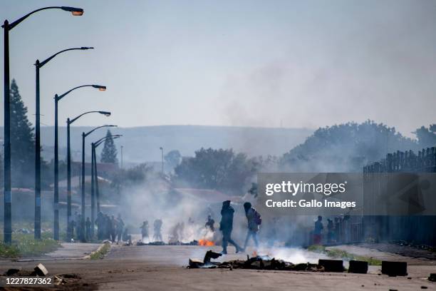 Bellville residents demonstrate during a large scale protest action in the Cape organised by the group Gatvol Capetonian on July 27, 2020 in Cape...