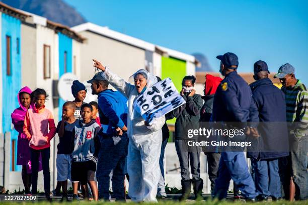 Residents demonstrate along the Duinefontein Road during a large scale protest action in the Cape organised by the group Gatvol Capetonian on July...