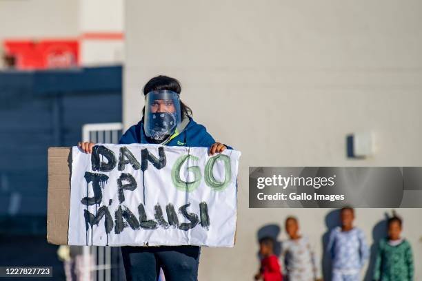 Residents demonstrate along the Duinefontein Road during a large scale protest action in the Cape organised by the group Gatvol Capetonian on July...