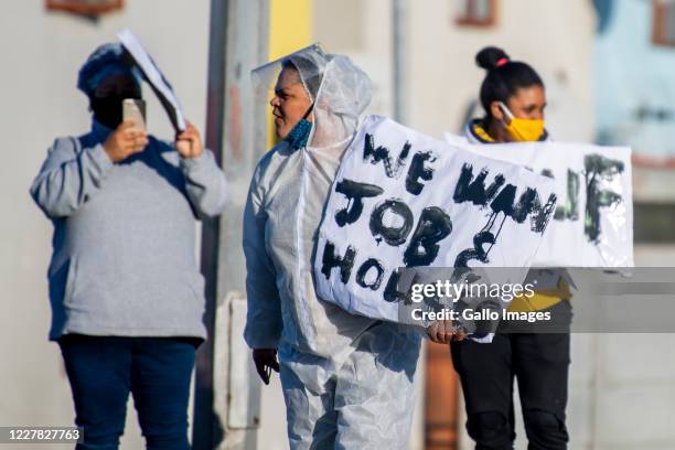 Residents demonstrate along the Duinefontein Road during a large scale protest action in the Cape organised by the group Gatvol Capetonian on July...