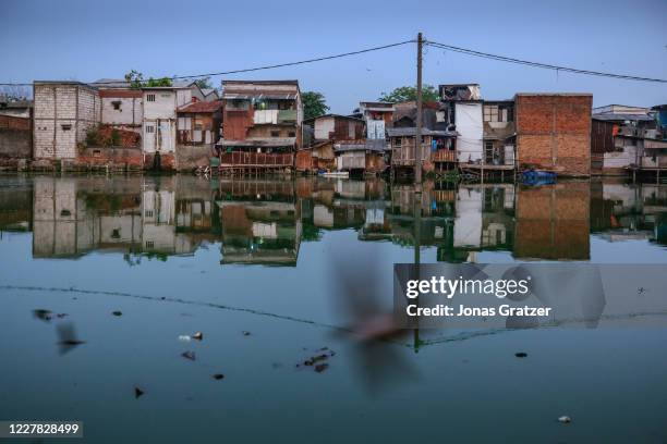 The floodwaters in Kampung Teko, Jakarta, cannot wash out to sea because the area lies below sea level. Jakarta is subsiding at record rates, thanks...